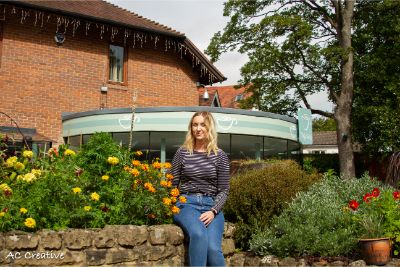 Bethan in front of the hospice