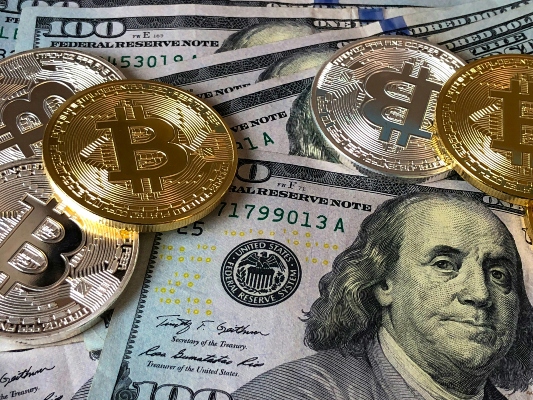Pile of American bank notes and coins
