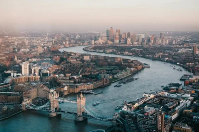 An aerial view of London , including the Thames and Tower Bridge