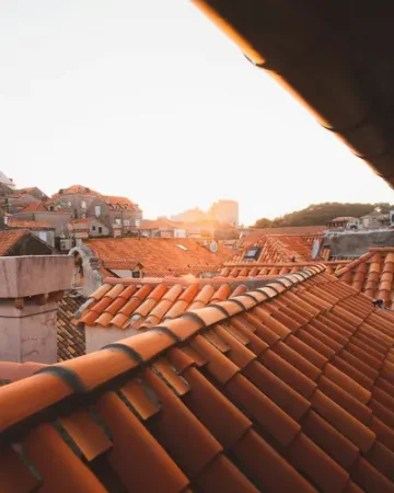 Multiple terracotta tiled roofs - Caring For Your Roof More Effectively