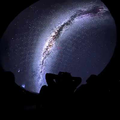 Xplore! visitors enjoying a detailed view of the Milky Way