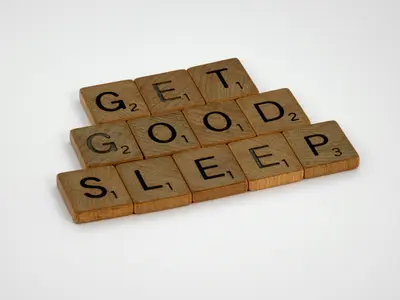 'Get Good Sleep' spelt out in Scrabble tiles - Your Guide to a More Restful Night