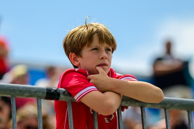 A young Wrexham supporter watches the match at Subaru Park