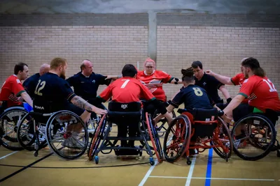 Wales wheelchair rugby league team huddle – 10,000 for Cymru: Wales Wheelchair Rugby League Launches World Cup Appeal