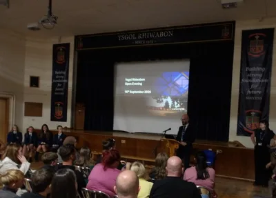 Families in the main hall at the Ysgol Rhiwabon Open Evening – Ysgol Rhiwabon Open Evening Welcomes Record Numbers