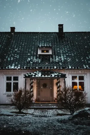 House exterior decorated for winter with snow - Sprucing Up Your Home for the Season