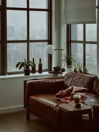 Cosy apartment living room with city view - Creating a Cozy Home Atmosphere for Less