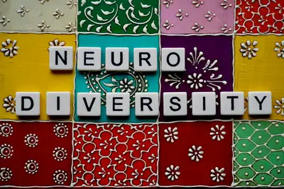 Neurodiversity concept spelled in letter tiles - Supporting Neurodiversity in Community Initiatives