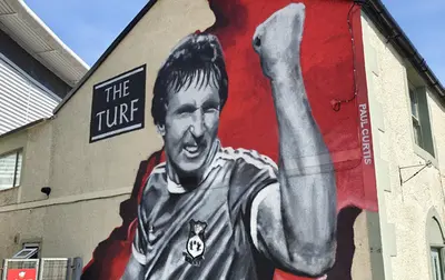 The mural of Joey Jones on the side of The Turf in Wrexham - Wayne's World: The Season Starts Now