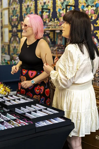 Kerry Fisher helping a client choose frames at Eyecadia – Eyecadia: Bespoke Eyewear, Styling and Colour Analysis in Wrexham