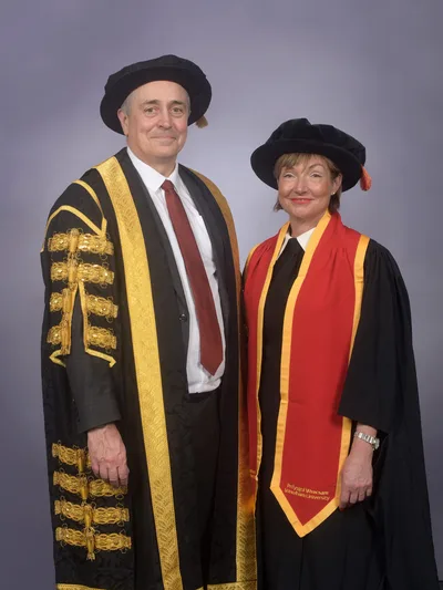 Rachel Clacher CBE and Professor Joe Yates in academic dress – Rachel Clacher CBE Appointed Wrexham University Chancellor