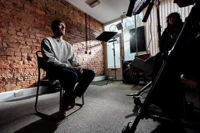 Artist Liam Stokes-Massey being interviewed on camera in Wrexham – Three Generations: New Documentary Celebrates the People and Culture of Wrexham