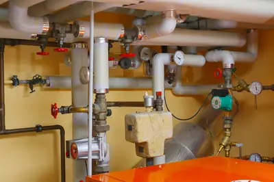 Domestic boiler pipework with valves, pressure gauges and a circulating pump - What Homeowners Need to Know About Boiler Care