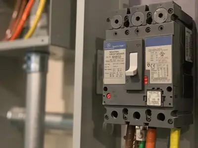 Close-up of an industrial circuit breaker mounted in a fuse board - Community Safety: What to Do in an Electrical Emergency