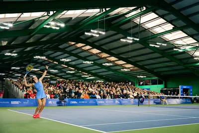 Spectators watching a match on the indoor show court at Wrexham Tennis & Padel Centre